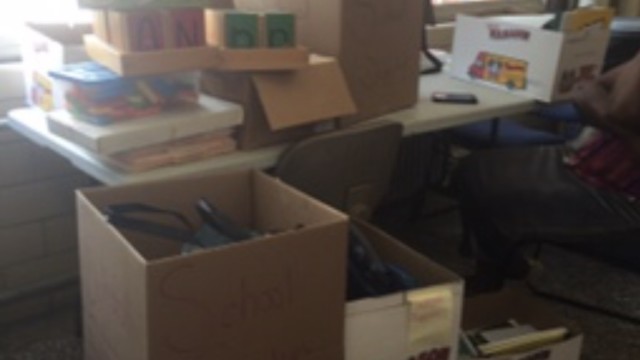 School supplies in multiple boxes. School supplies in multiple boxes.